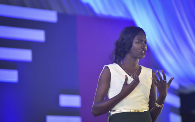 Former refugee Mary Nyiriak Maker speaks on stage at the first ever TEDx event held at a refugee camp in Kakuma, Kenya.
