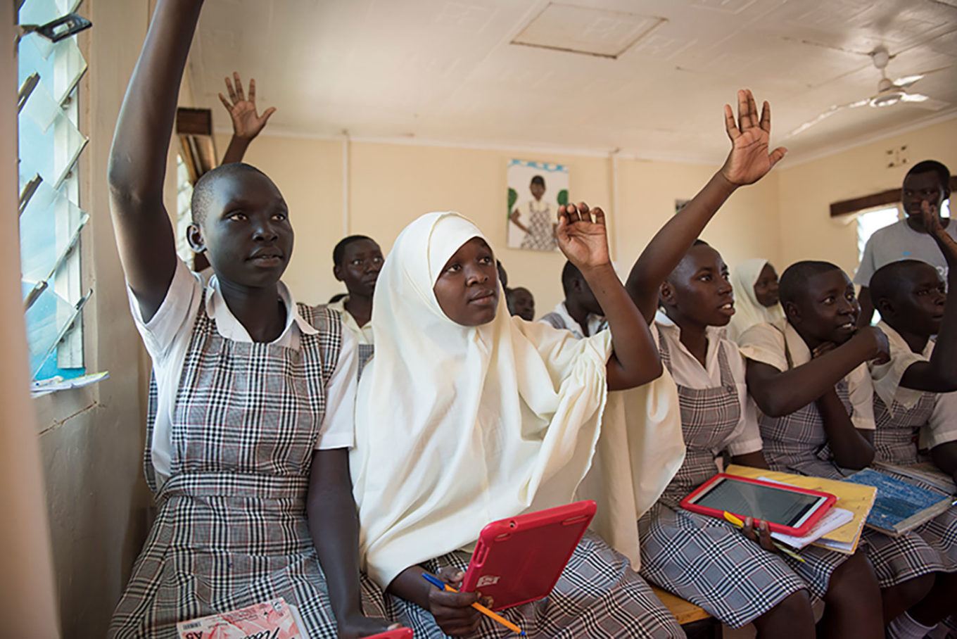 Kenya. Mary Nyalat and Mumina Khalif  use tablets in Class 8 at Angelina Jolie School